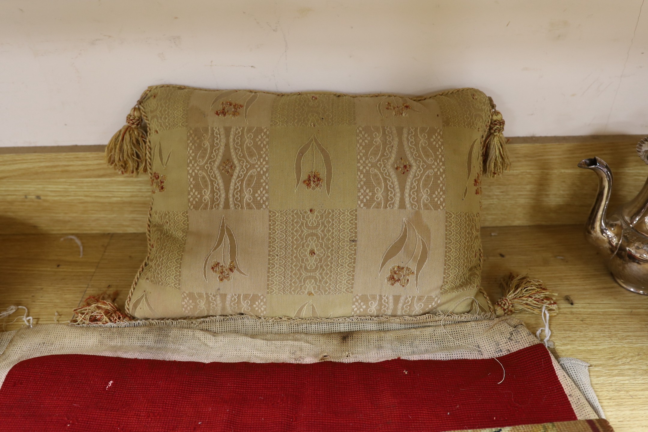 A French 18th century woolwork cushion, 2 chair covers, another panel, a tasselled brocade cushion and an Indian metallic brocaded patchworked cover